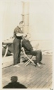 Image of MacMillan cutting Borup's hair - deck of Roosevelt